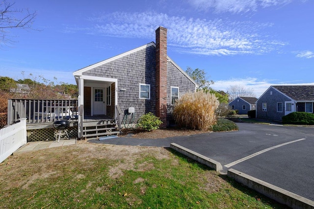 exterior space featuring a wooden deck