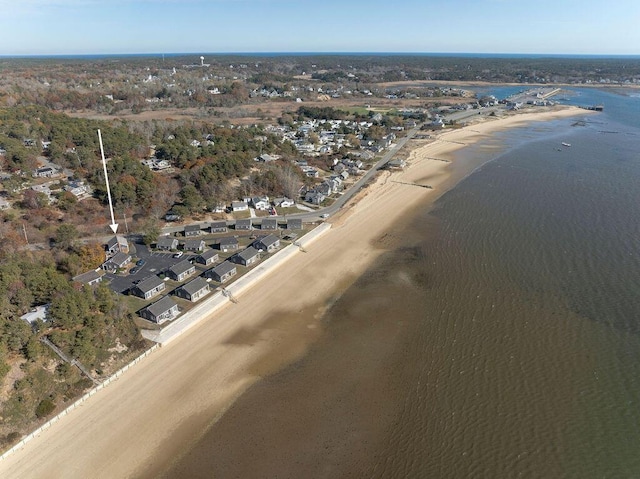 birds eye view of property featuring a water view and a view of the beach