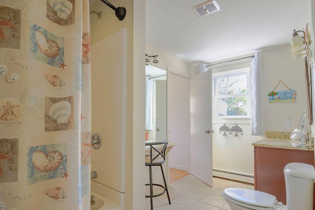 full bathroom featuring vanity, toilet, a baseboard heating unit, and shower / washtub combination