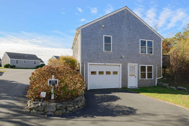 view of side of property with a garage