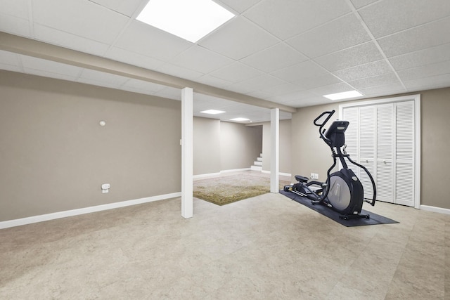 workout room with a paneled ceiling