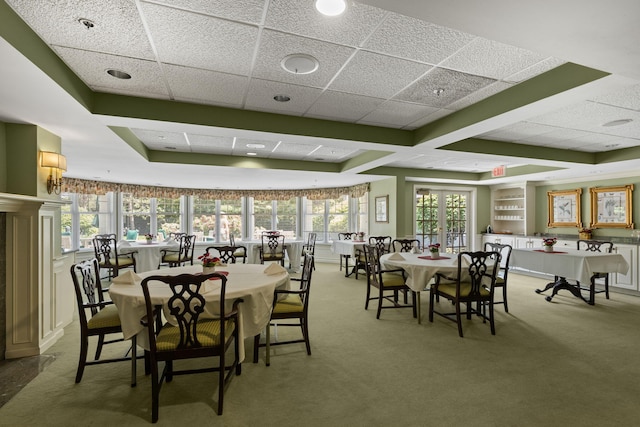 18 W Rd Unit 315, Orleans, MA 02653 - dining area featuring carpet floors and a drop ceiling