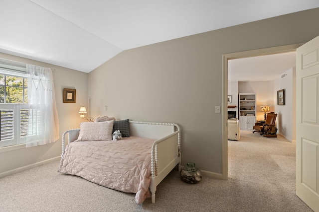18 W Rd Unit 315, Orleans, MA 02653 - carpeted bedroom with vaulted ceiling and baseboards