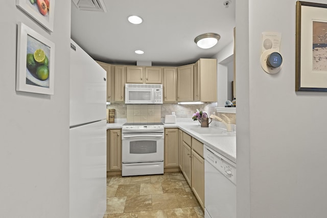 18 W Rd Unit 315, Orleans, MA 02653 - kitchen featuring white appliances, a sink, light countertops, stone finish floors, and tasteful backsplash