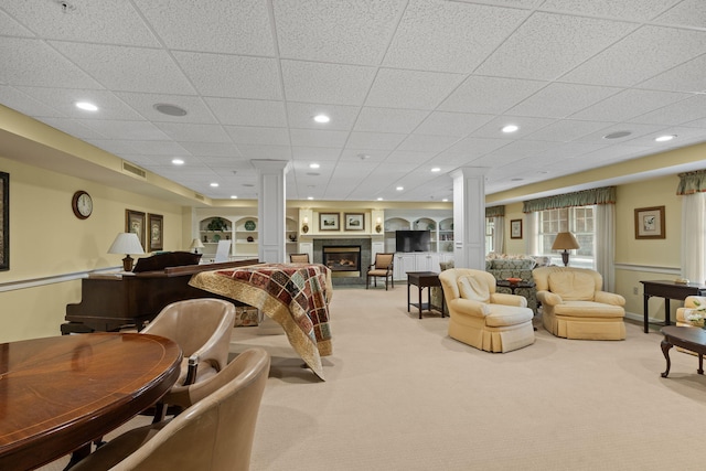18 W Rd Unit 315, Orleans, MA 02653 - living area with carpet floors, a glass covered fireplace, decorative columns, and recessed lighting