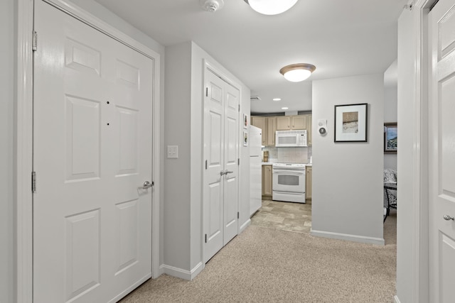 18 W Rd Unit 315, Orleans, MA 02653 - hallway featuring baseboards, light carpet, and recessed lighting
