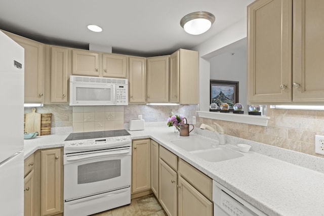 18 W Rd Unit 315, Orleans, MA 02653 - kitchen featuring white appliances, a sink, light countertops, decorative backsplash, and light brown cabinets