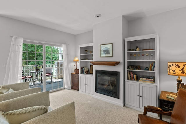 18 W Rd Unit 315, Orleans, MA 02653 - carpeted living room with a glass covered fireplace