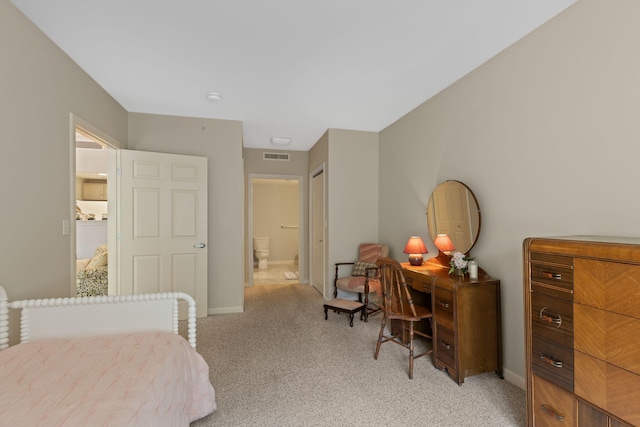 18 W Rd Unit 315, Orleans, MA 02653 - bedroom with light colored carpet, ensuite bath, and baseboards