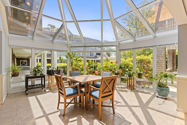 18 W Rd Unit 315, Orleans, MA 02653 - sunroom / solarium featuring wainscoting, a decorative wall, a wall of windows, and a high ceiling