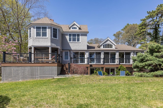 back of property featuring stairs, roof with shingles, a yard, and a deck