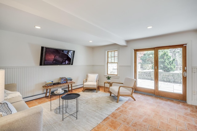 living area with wainscoting, light tile patterned floors, beamed ceiling, and recessed lighting