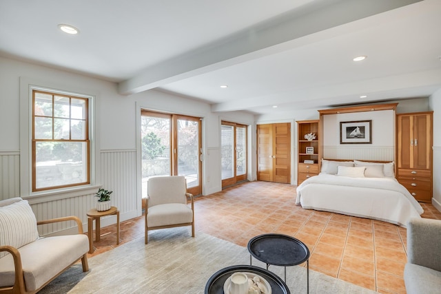 bedroom featuring wainscoting, beam ceiling, access to outside, recessed lighting, and light tile patterned flooring