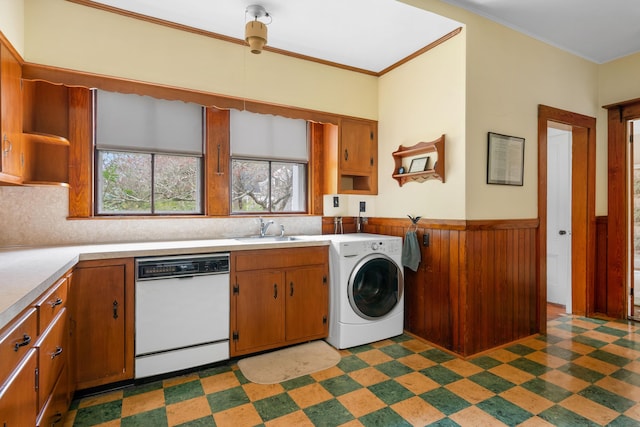 laundry area featuring sink, washer / clothes dryer, and crown molding