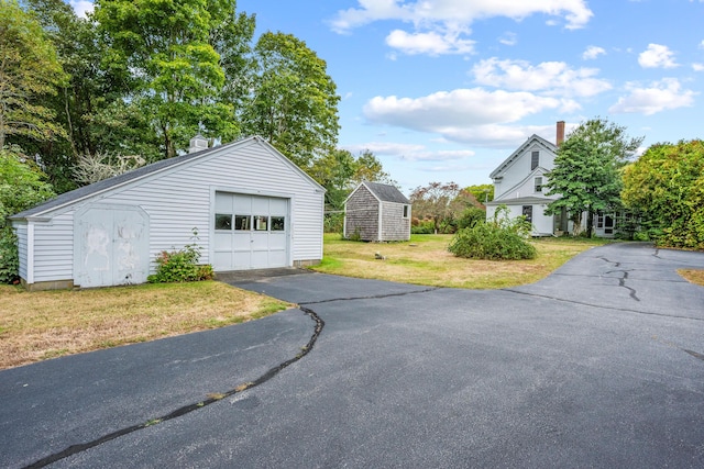 garage with a yard