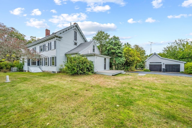 exterior space featuring a garage and a yard