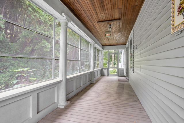 unfurnished sunroom featuring wooden ceiling