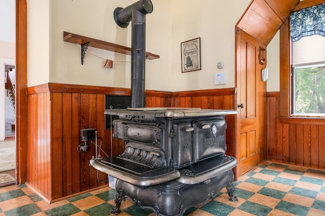 details with a wood stove and wood walls