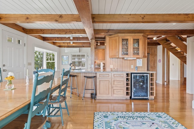 7 Sunrise Ln, Sandwich, MA 02563 - indoor bar featuring beverage cooler, light wood-style flooring, wood ceiling with exposed beams, and stairway