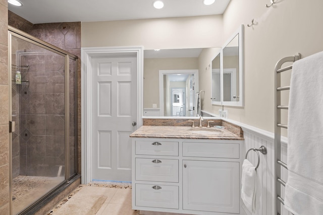 7 Sunrise Ln, Sandwich, MA 02563 - full bathroom with a stall shower, vanity, a wainscoted wall, tile patterned floors, and recessed lighting