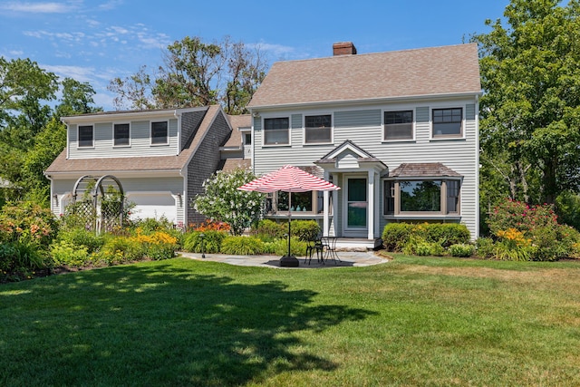 7 Sunrise Ln, Sandwich, MA 02563 - view of front of home with a chimney, a front yard, roof with shingles, and an attached garage