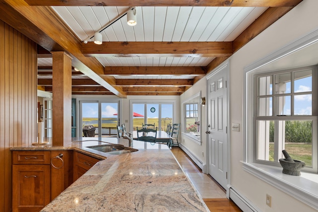 7 Sunrise Ln, Sandwich, MA 02563 - interior space featuring a baseboard radiator, wooden ceiling with exposed beams, light wood finished floors, and baseboards