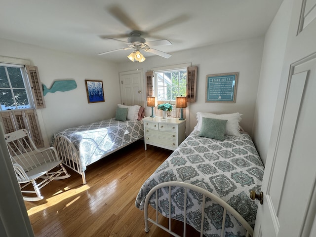 bedroom featuring ceiling fan and hardwood / wood-style floors