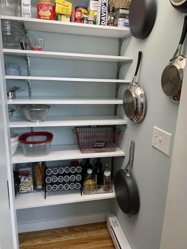 pantry featuring baseboard heating