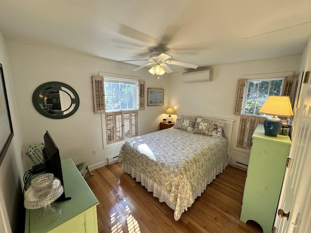 bedroom featuring an AC wall unit, a baseboard radiator, wood-type flooring, and ceiling fan