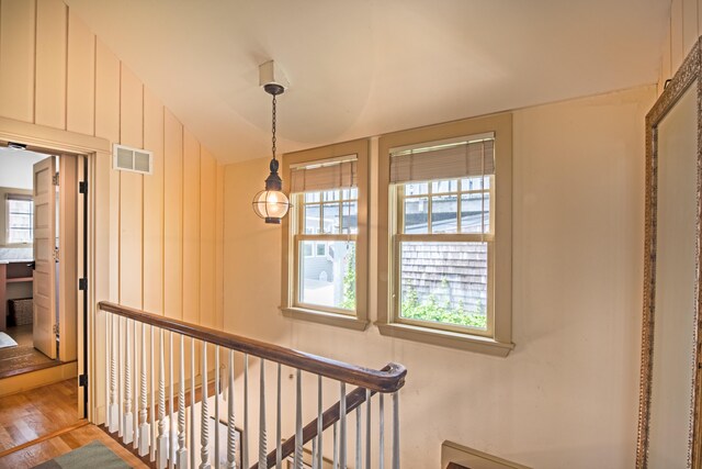 351A Commercial St Unit A1, Provincetown, MA 02657 - stairs featuring wood finished floors and vaulted ceiling
