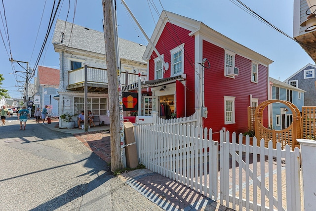 351A Commercial St Unit A1, Provincetown, MA 02657 - view of front of house with a fenced front yard and cooling unit