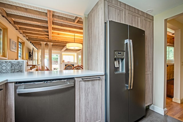 351A Commercial St Unit A1, Provincetown, MA 02657 - kitchen featuring appliances with stainless steel finishes, healthy amount of natural light, light countertops, and a peninsula
