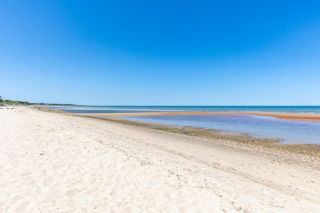 property view of water featuring a view of the beach