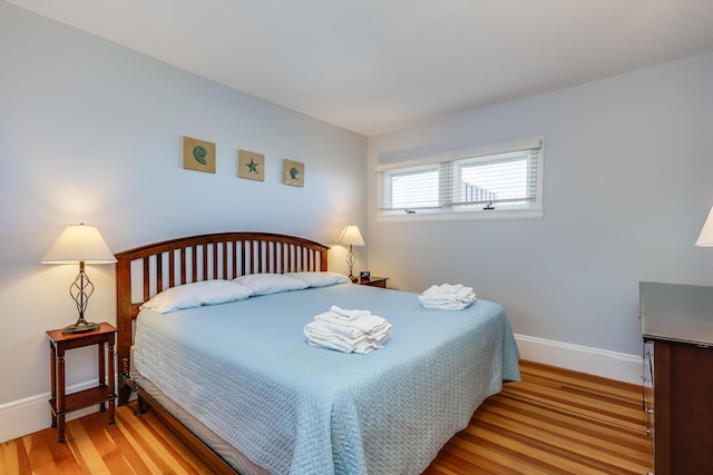 bedroom with light wood-type flooring