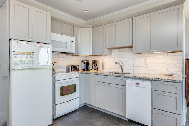 kitchen with crown molding, sink, light stone counters, white appliances, and decorative backsplash