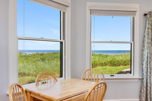 dining area featuring a water view