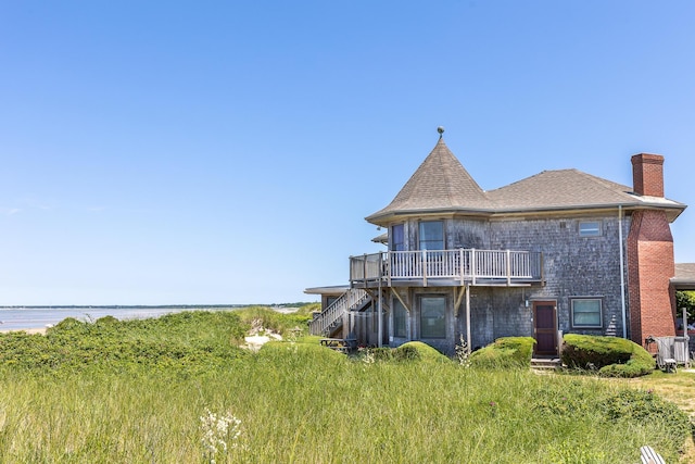 back of house featuring a water view