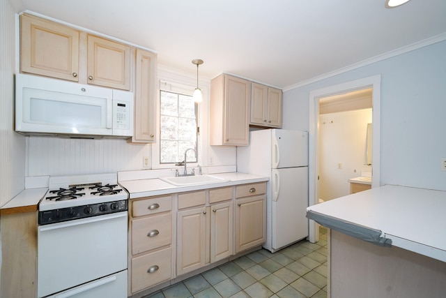 kitchen with white appliances, a sink, light countertops, light brown cabinetry, and crown molding