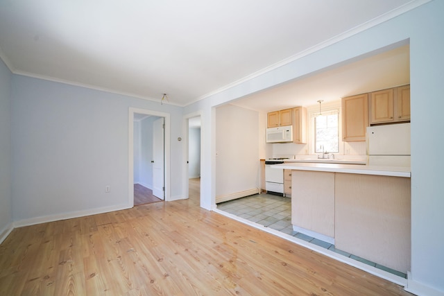 kitchen featuring light wood finished floors, light countertops, light brown cabinets, a sink, and white appliances