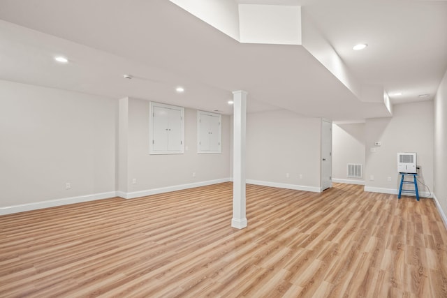 29 Hiawatha Rd, Harwich Port, MA 02646 - finished below grade area with recessed lighting, baseboards, heating unit, light wood-type flooring, and visible vents