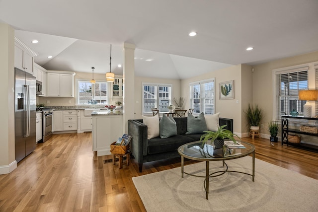 29 Hiawatha Rd, Harwich Port, MA 02646 - living area featuring recessed lighting, baseboards, vaulted ceiling, and light wood-style floors