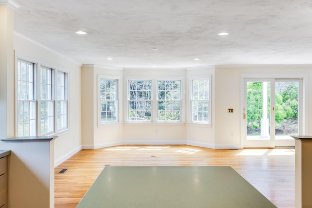 workout area with crown molding, recessed lighting, baseboards, and wood finished floors