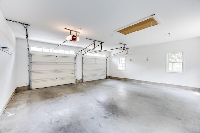 garage featuring baseboards and a garage door opener