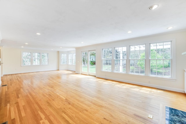 unfurnished living room featuring light wood-style floors, baseboards, and recessed lighting