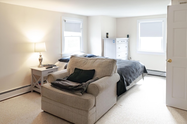 carpeted bedroom featuring a baseboard radiator