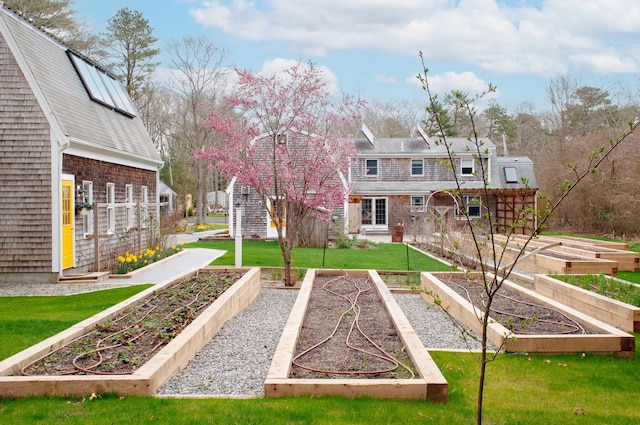 view of property's community with a lawn