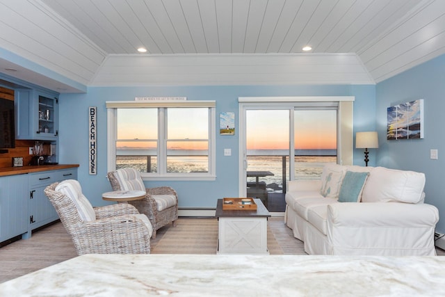 living room featuring lofted ceiling, wooden ceiling, a baseboard heating unit, a water view, and crown molding