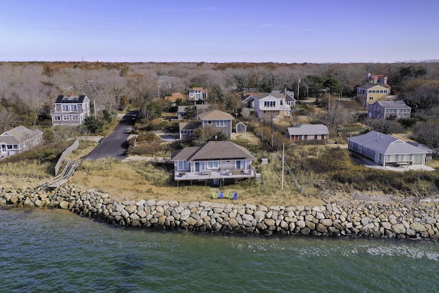 birds eye view of property featuring a water view and a residential view