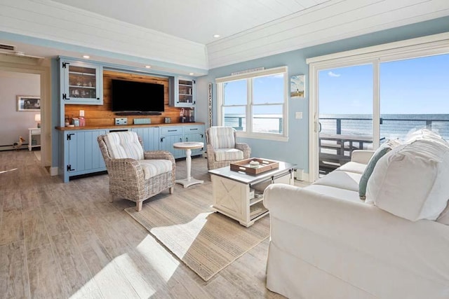 living room featuring light wood-style flooring and recessed lighting