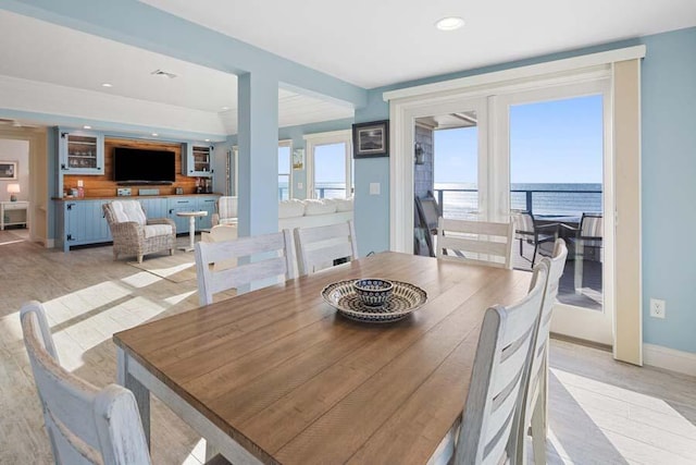 dining room with recessed lighting, plenty of natural light, and baseboards